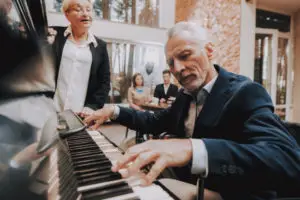 Older man playing piano